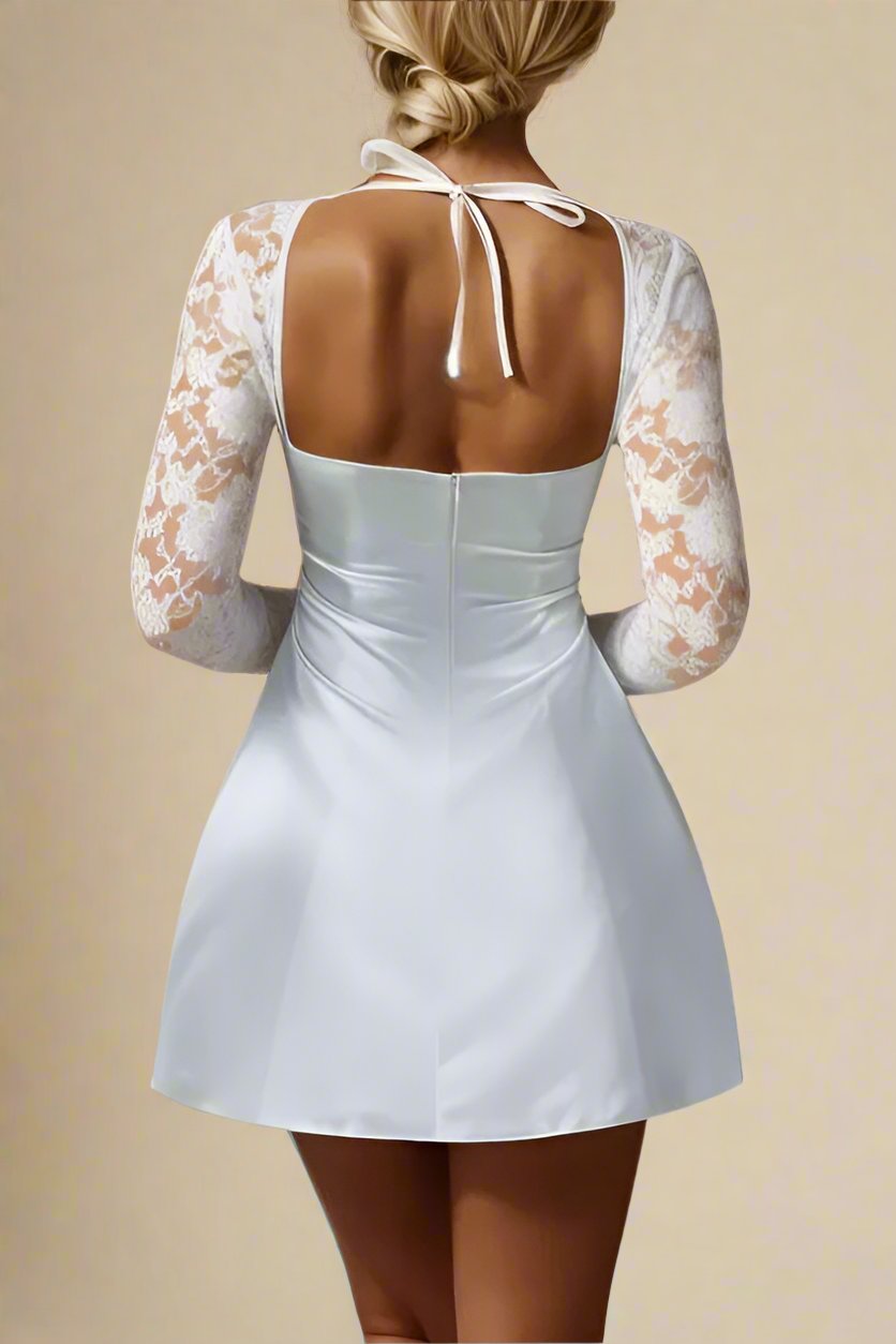 Woman wearing a figure flattering Andy Long Sleeve Mini Dress - Pearl White BODYCON COLLECTION