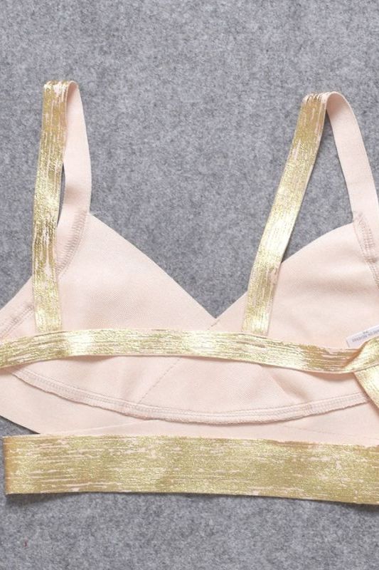 Woman wearing a figure flattering Ang Bandage Crop Top - Gold BODYCON COLLECTION