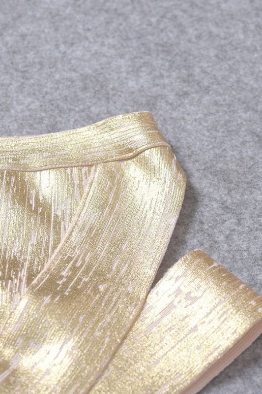Woman wearing a figure flattering Ang Bandage Crop Top - Gold BODYCON COLLECTION