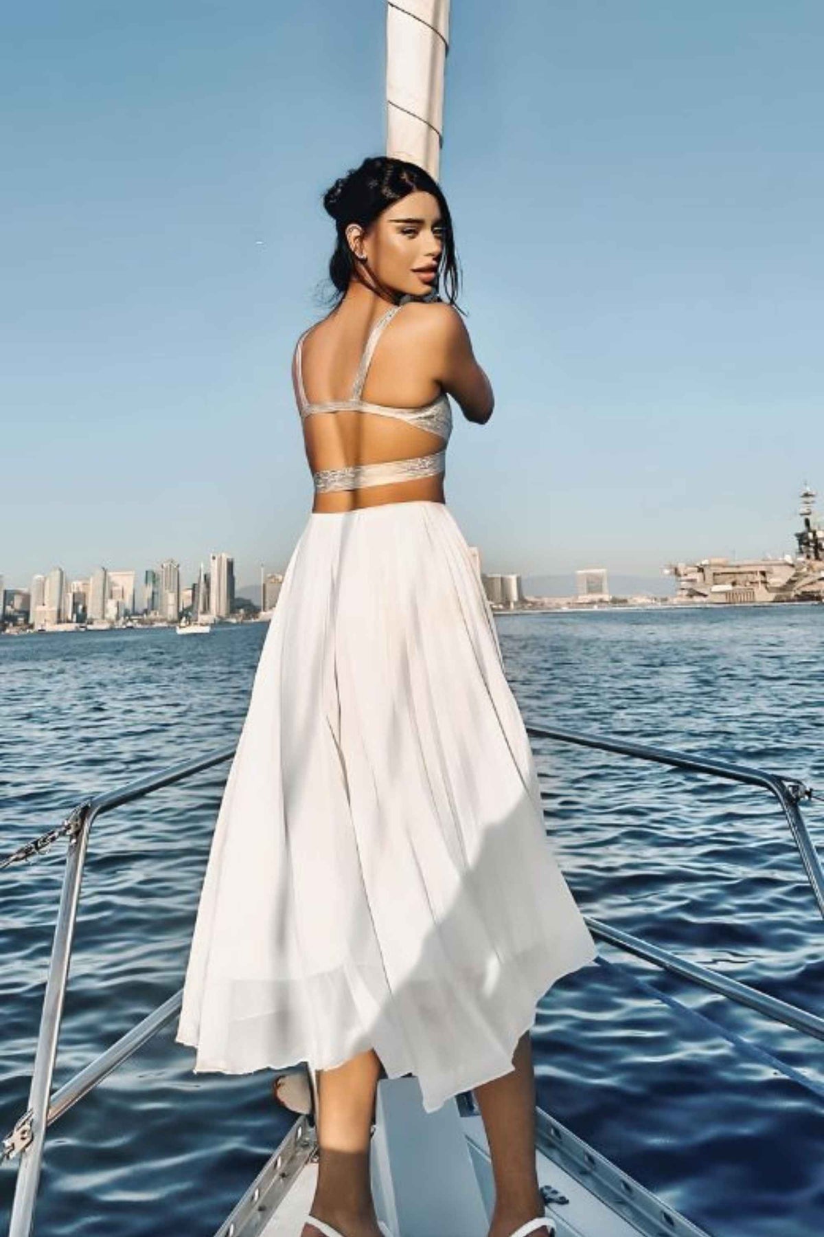 Woman wearing a figure flattering Ang Bandage Crop Top - Gold BODYCON COLLECTION