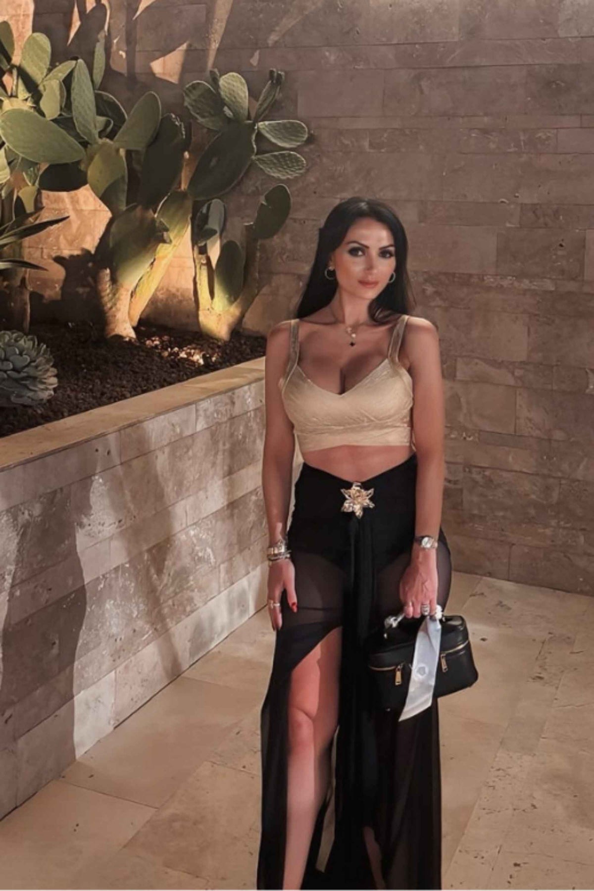 Woman wearing a figure flattering Ang Bandage Leather Crop Top - Gold BODYCON COLLECTION