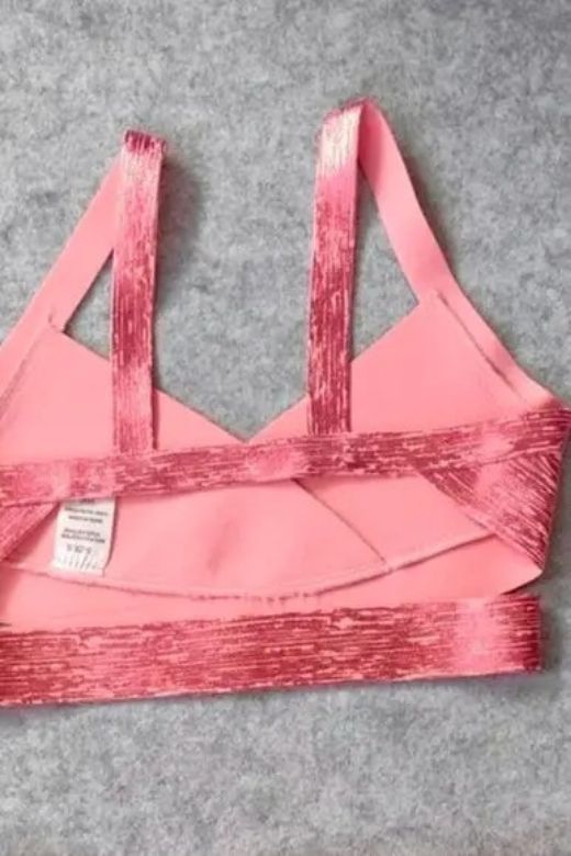 Woman wearing a figure flattering Ang Bandage Metallic Crop Top - Hot Pink BODYCON COLLECTION