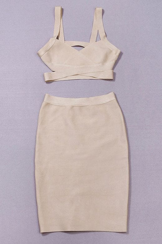 Woman wearing a figure flattering Ang Bandage Top and Knee Length Skirt Set- Cream BODYCON COLLECTION