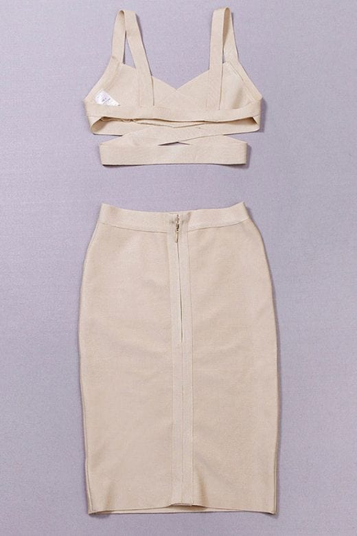 Woman wearing a figure flattering Ang Bandage Top and Knee Length Skirt Set- Cream BODYCON COLLECTION