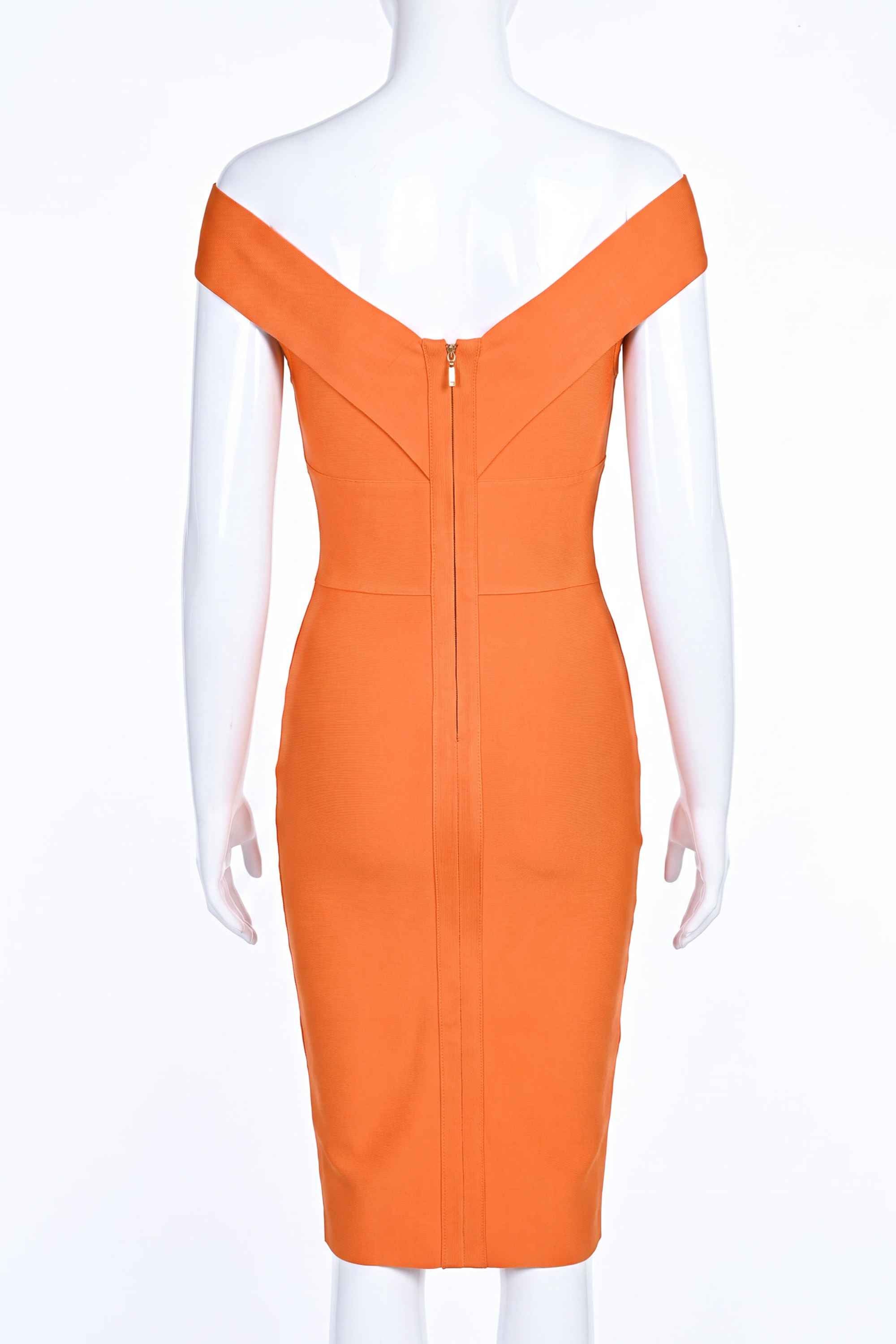 Woman wearing a figure flattering Ash Bandage Dress - Apricot Orange Bodycon Collection
