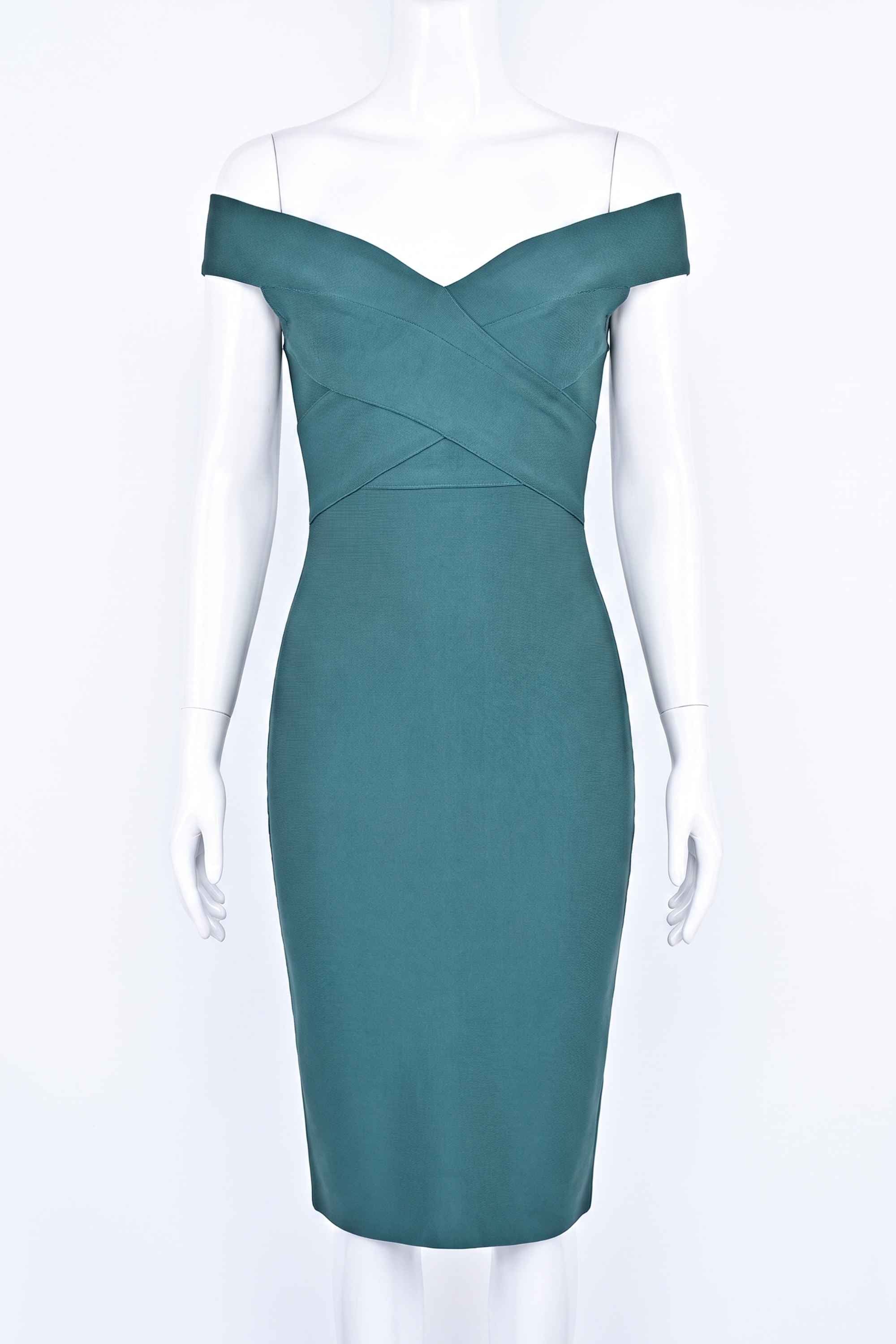 Woman wearing a figure flattering Ash Bandage Dress - Emerald Green Bodycon Collection