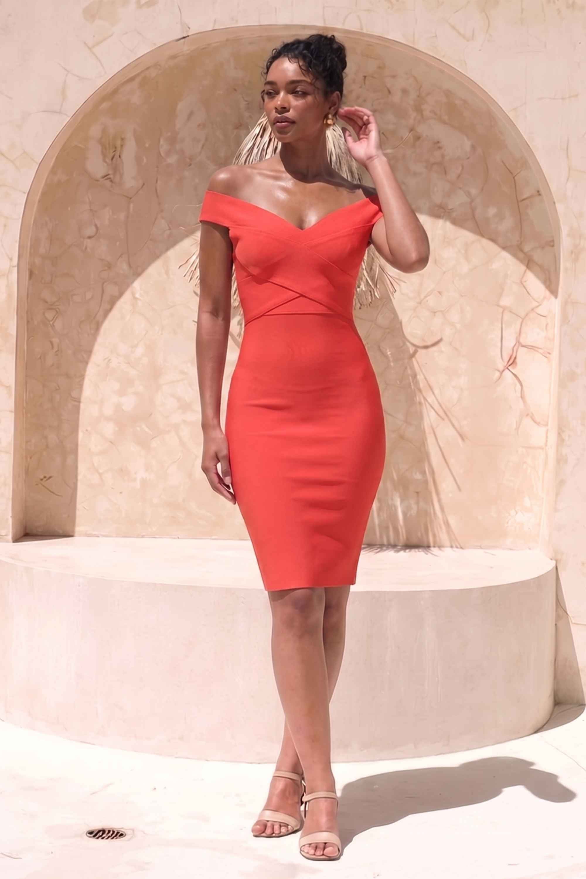 Woman wearing a figure flattering Ash Bandage Dress - Lipstick Red Bodycon Collection