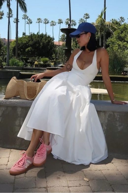 Woman wearing a figure flattering Austen Bodycon Midi Dress - Pearl White BODYCON COLLECTION