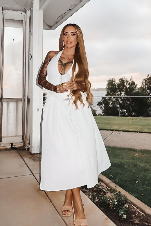 Woman wearing a figure flattering Austen Bodycon Midi Dress - Pearl White BODYCON COLLECTION