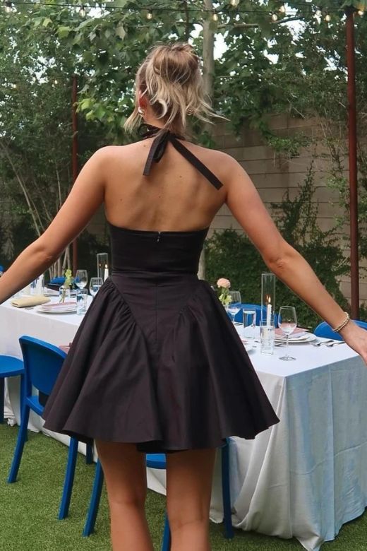 Woman wearing a figure flattering Austen Bodycon Mini Dress - Classic Black BODYCON COLLECTION