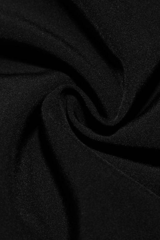 Woman wearing a figure flattering Austen Bodycon Mini Dress - Classic Black BODYCON COLLECTION