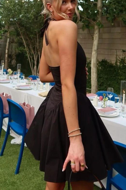 Woman wearing a figure flattering Austen Bodycon Mini Dress - Classic Black BODYCON COLLECTION
