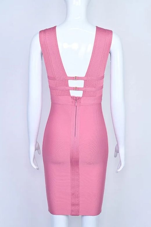 Woman wearing a figure flattering Bay Bandage Dress - Ballet Pink Bodycon Collection