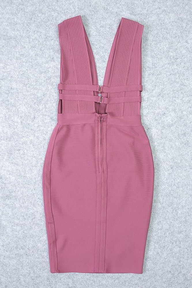 Woman wearing a figure flattering Bay Bandage Dress - Ballet Pink Bodycon Collection