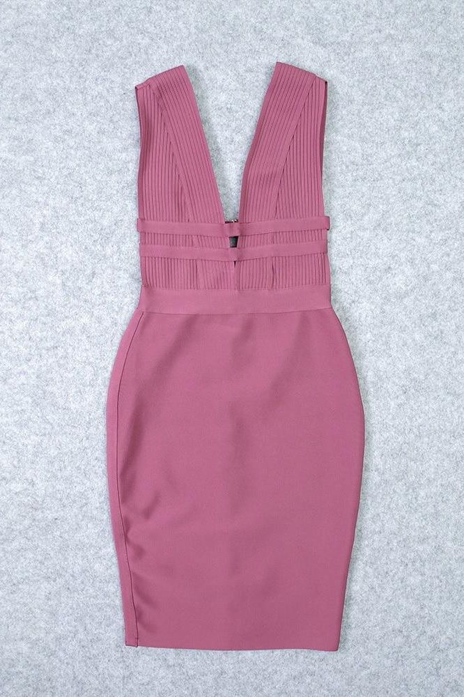 Woman wearing a figure flattering Bay Bandage Dress - Ballet Pink Bodycon Collection