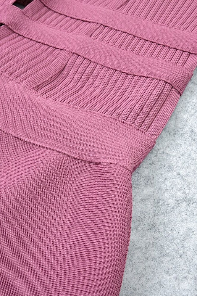 Woman wearing a figure flattering Bay Bandage Dress - Ballet Pink Bodycon Collection