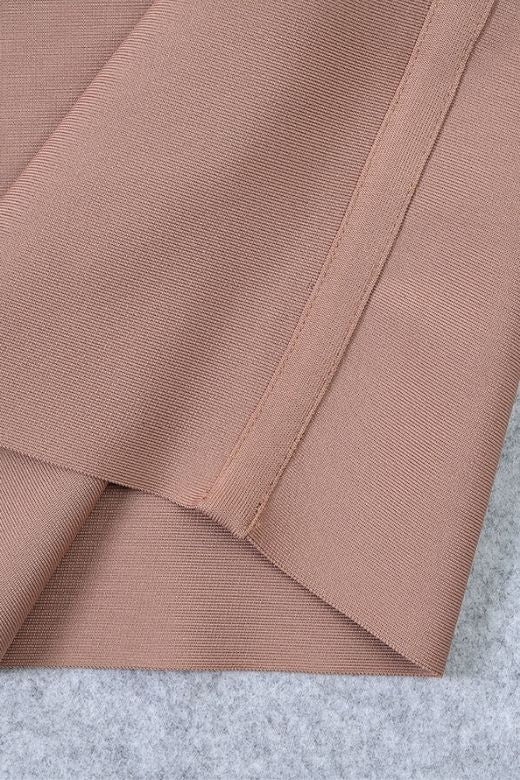 Woman wearing a figure flattering Bay Bandage Dress - Nude Bodycon Collection