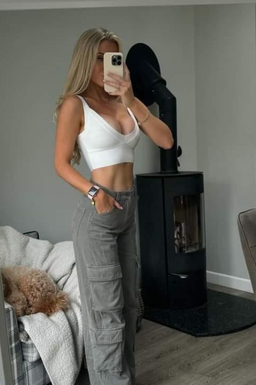 Woman wearing a figure flattering Bee Bandage Crop Top - Pearl White BODYCON COLLECTION