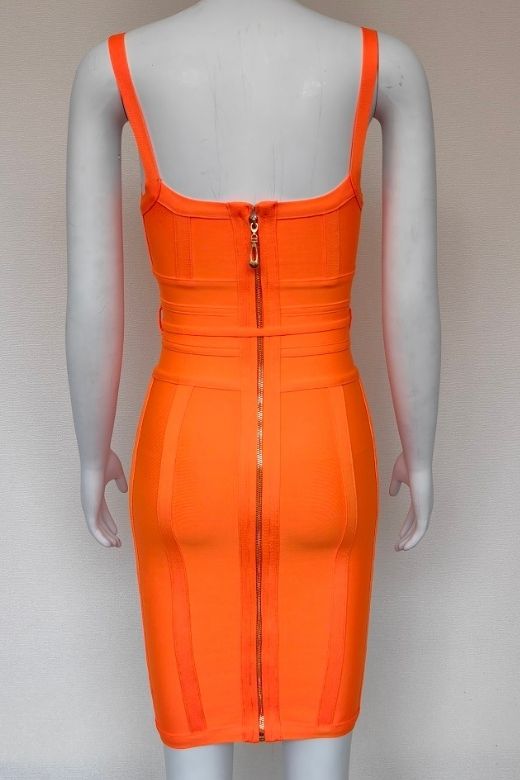 Woman wearing a figure flattering Bek Bandage Dress - Apricot Orange Bodycon Collection