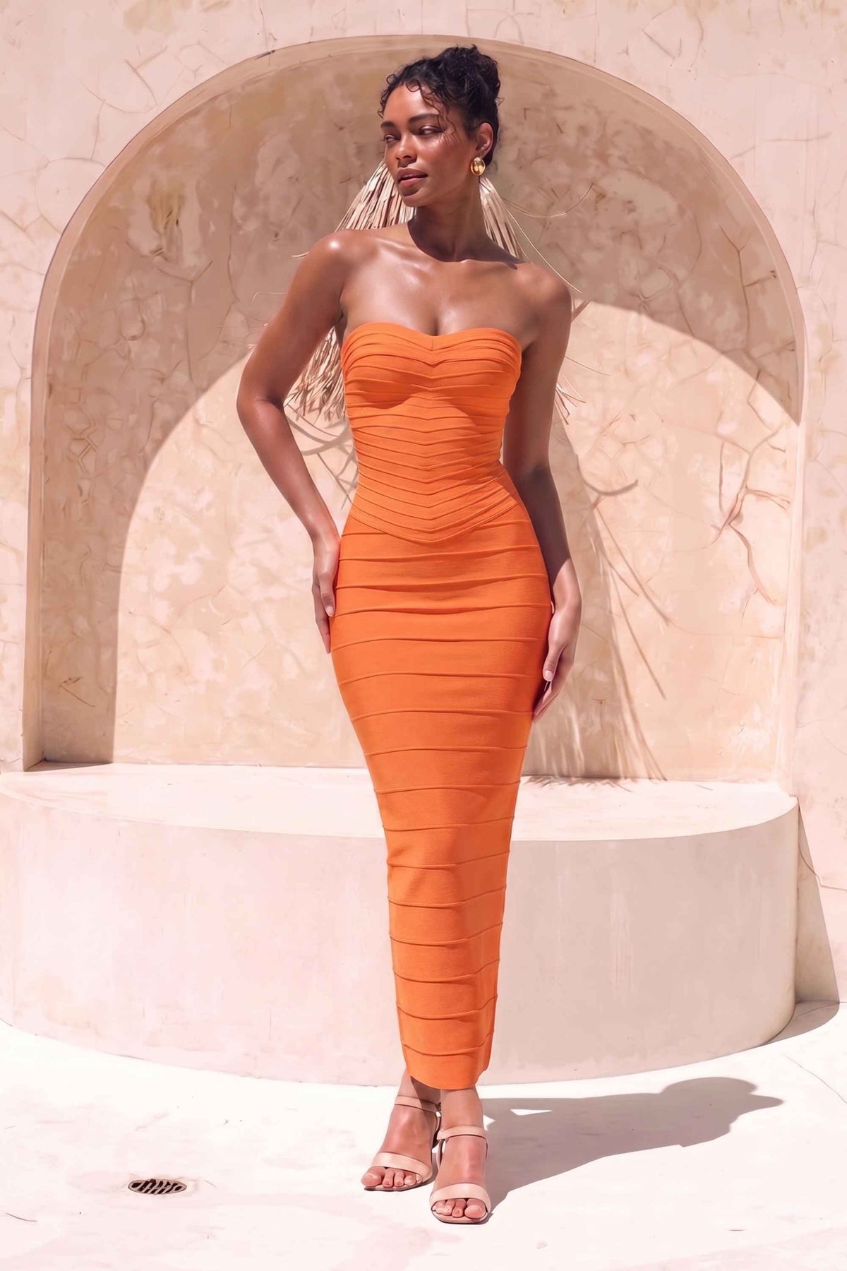 Woman wearing a figure flattering Belle Bandage Maxi Dress - Apricot Orange BODYCON COLLECTION Pty Ltd