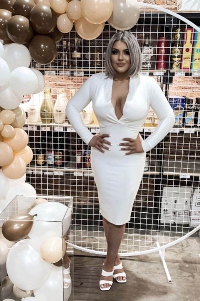 Woman wearing a figure flattering Blaire Long Sleeve Bandage Dress - Classic Black BODYCON COLLECTION