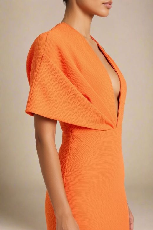Woman wearing a figure flattering Blake Bandage Maxi Dress - Apricot Orange BODYCON COLLECTION