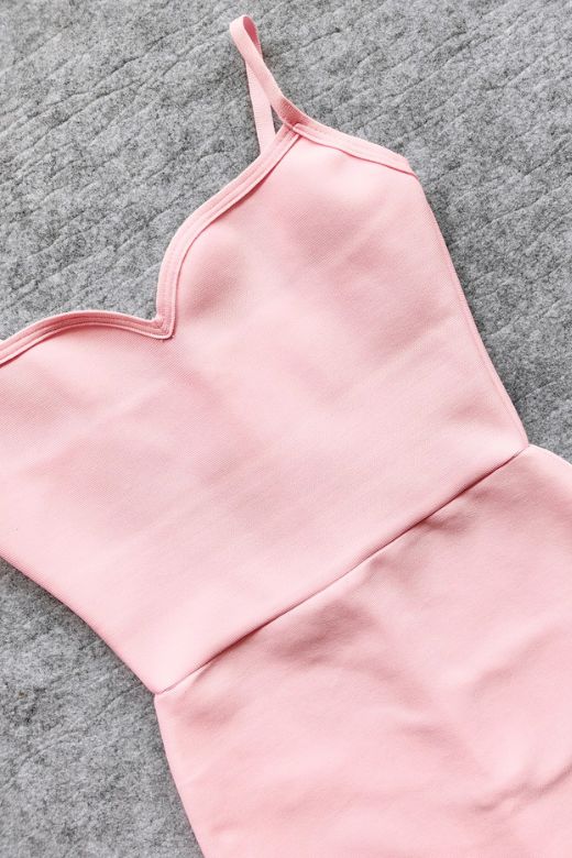 Woman wearing a figure flattering Blanche Bandage Maxi Dress - Dusty Pink BODYCON COLLECTION