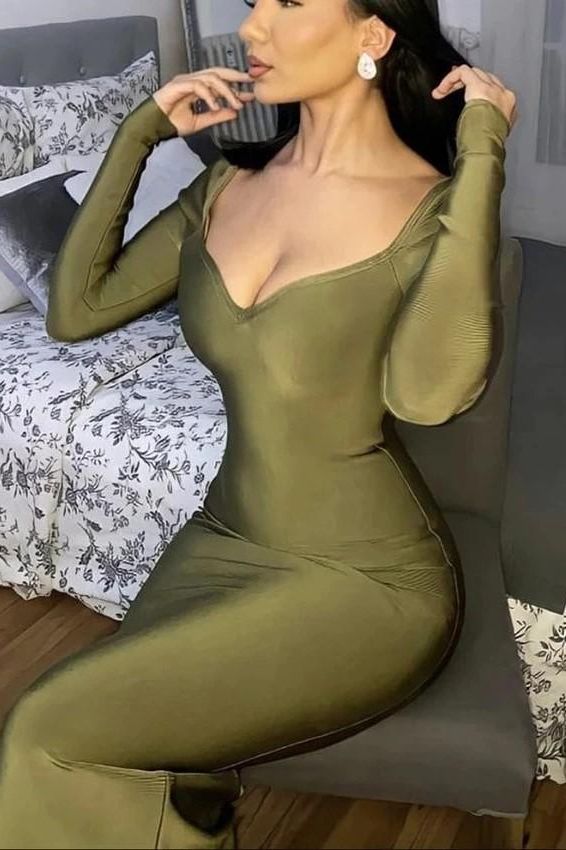 Woman wearing a figure flattering Blanche Long Sleeve Bandage Midi Dress - Classic Black BODYCON COLLECTION
