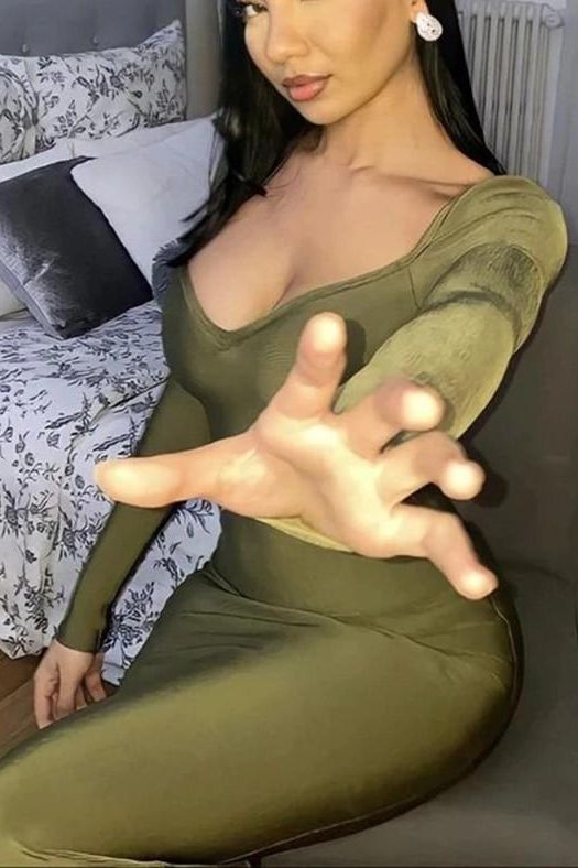 Woman wearing a figure flattering Blanche Long Sleeve Bandage Midi Dress - Olive Green BODYCON COLLECTION