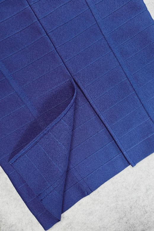 Woman wearing a figure flattering Breanna Bandage Dress - Navy Blue BODYCON COLLECTION