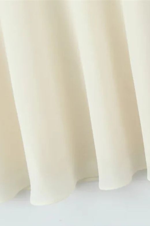 Woman wearing a figure flattering Cali Wrap Top and Maxi Skirt Set - Ivory White BODYCON COLLECTION