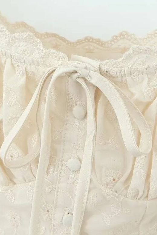Woman wearing a figure flattering Cali Wrap Top - Ivory White BODYCON COLLECTION
