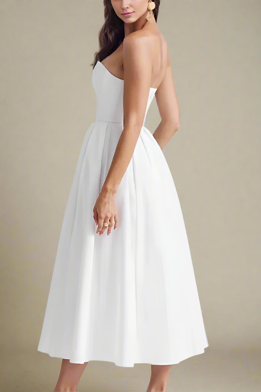 Woman wearing a figure flattering Capri Bodycon Strapless Midi Dress - Pearl White BODYCON COLLECTION
