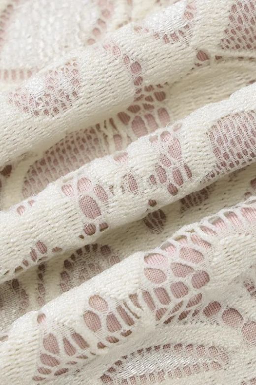 Woman wearing a figure flattering Charlotte Long Sleeve Bodycon Mini Dress - Cream BODYCON COLLECTION