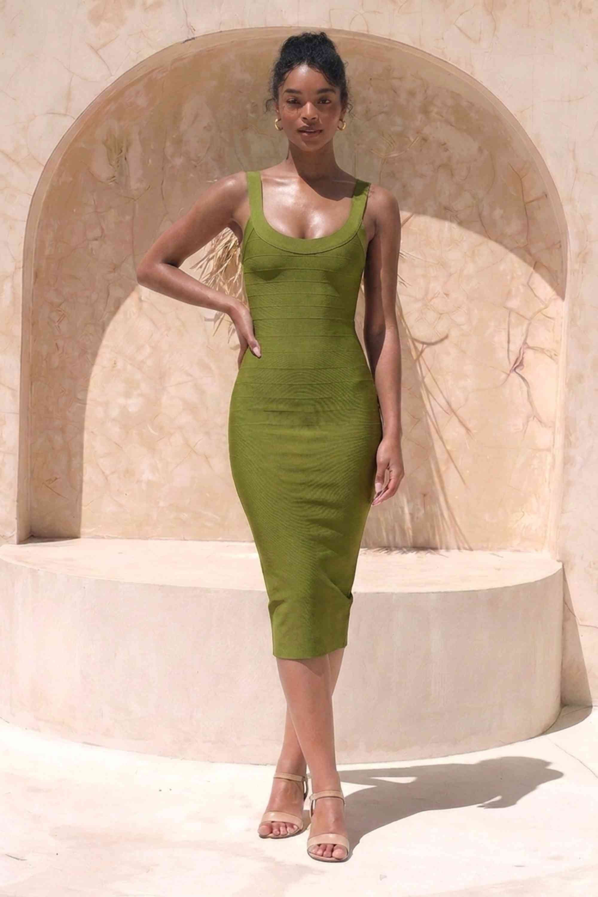 Woman wearing a figure flattering Cindy Bandage Midi Dress - Army Green BODYCON COLLECTION Pty Ltd