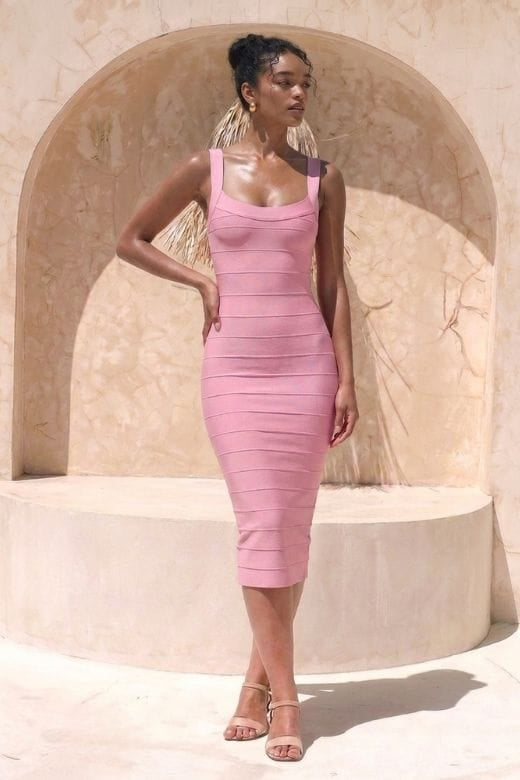 Woman wearing a figure flattering Cindy Bandage Midi Dress - Blush Pink BODYCON COLLECTION Pty Ltd