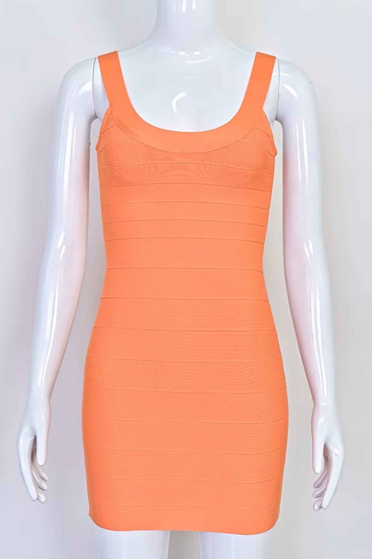 Woman wearing a figure flattering Cindy Bandage Mini Dress - Coral BODYCON COLLECTION Pty Ltd