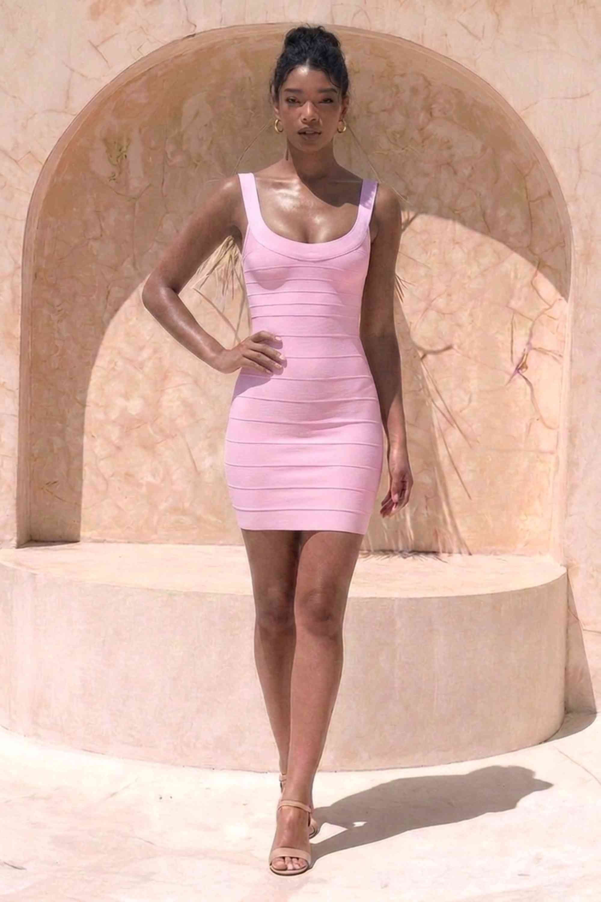 Woman wearing a figure flattering Cindy Bandage Mini Dress - Dusty Pink BODYCON COLLECTION Pty Ltd