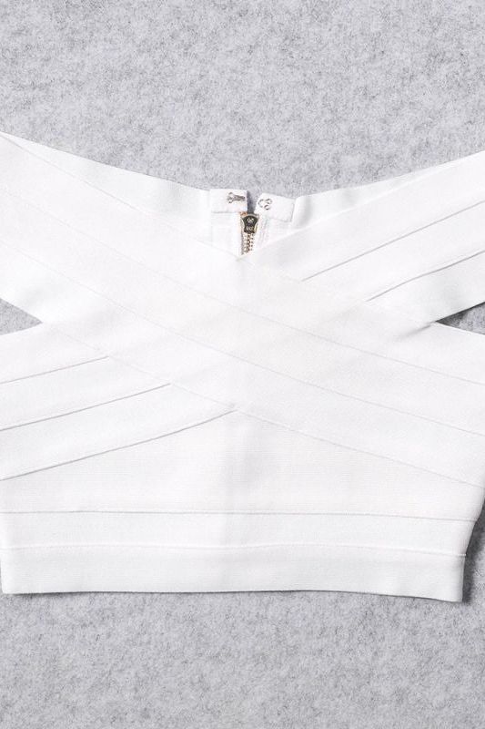 Woman wearing a figure flattering Cindy Bandage Off Shoulder Crop Top - Pearl White BODYCON COLLECTION
