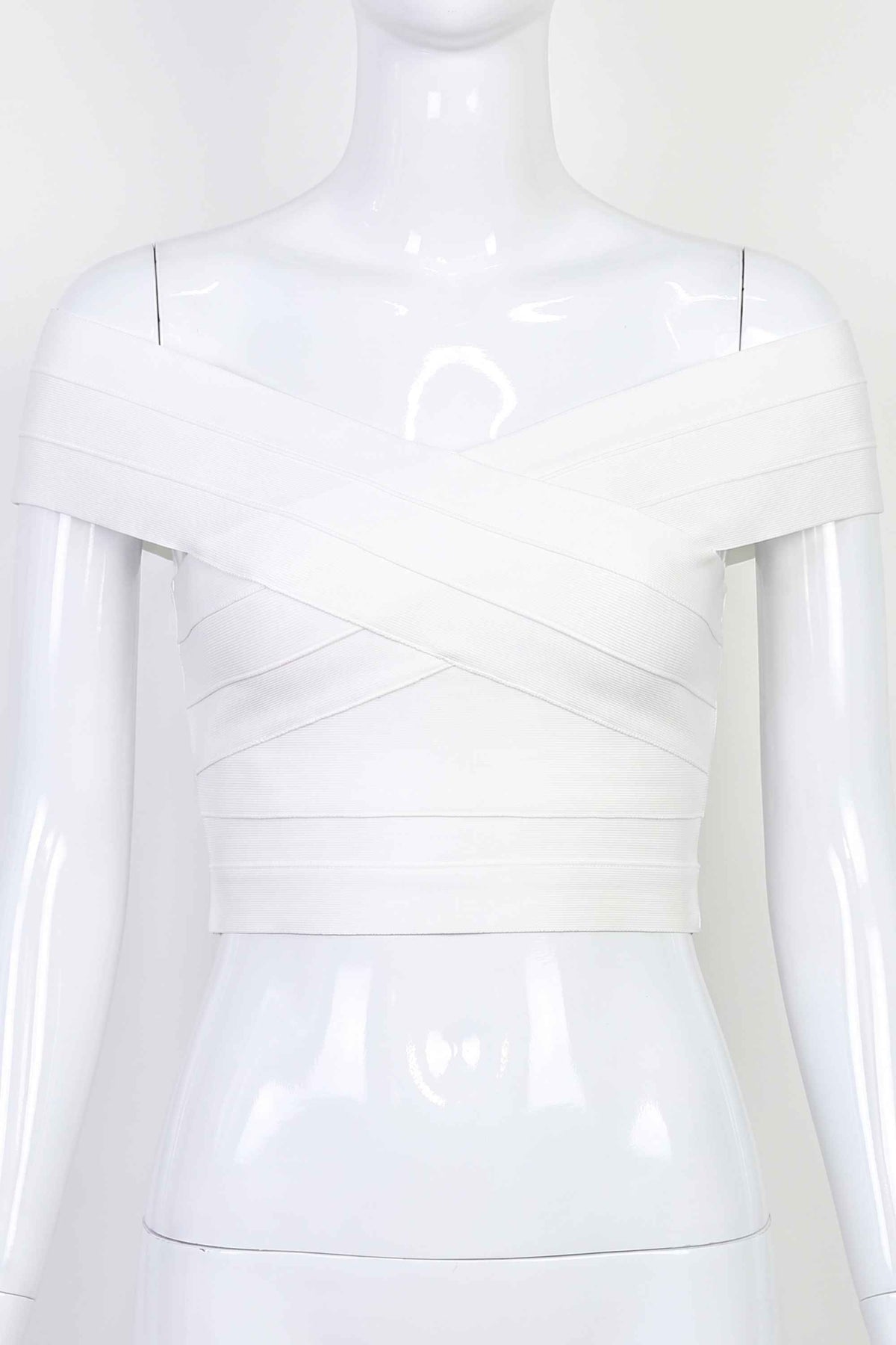 Woman wearing a figure flattering Cindy Bandage Off Shoulder Crop Top - Pearl White BODYCON COLLECTION