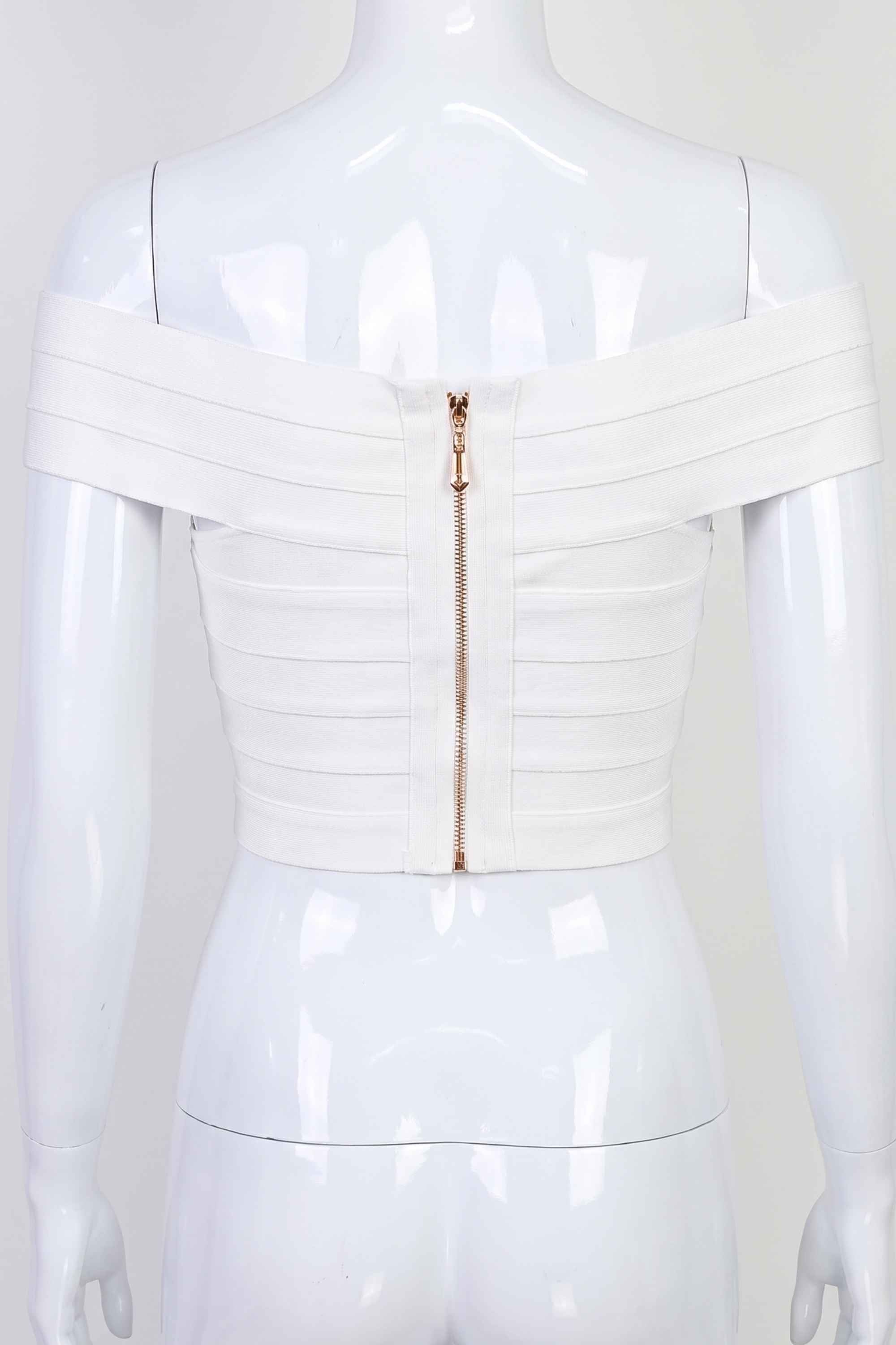 Woman wearing a figure flattering Cindy Bandage Off Shoulder Crop Top - Pearl White BODYCON COLLECTION