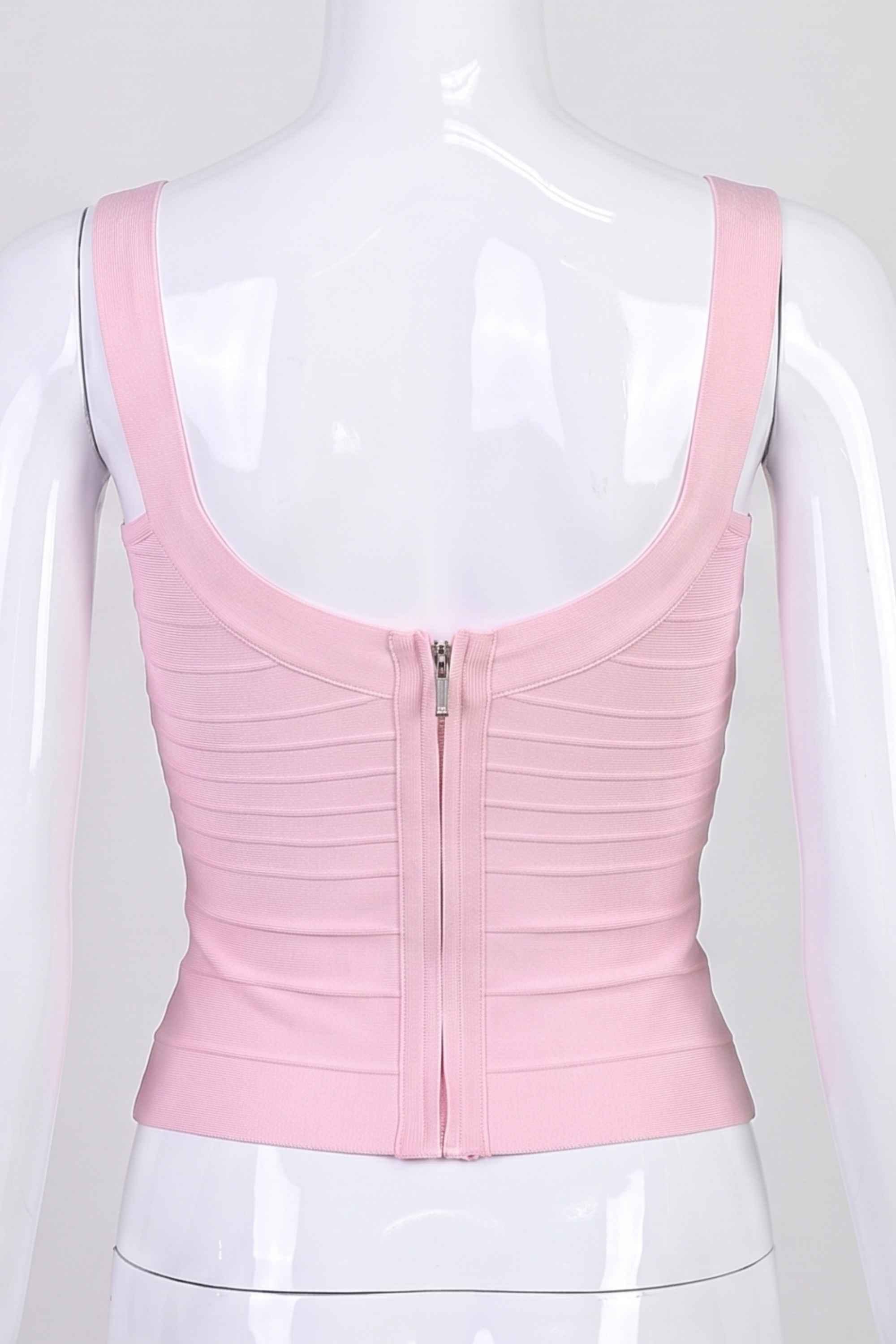 Woman wearing a figure flattering Cindy Bandage Top - Dusty Pink BODYCON COLLECTION Pty Ltd
