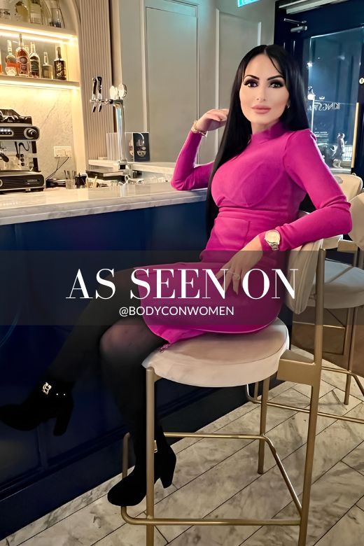 Woman wearing a figure flattering Dee Long Sleeve Bandage Dress - Classic Black BODYCON COLLECTION