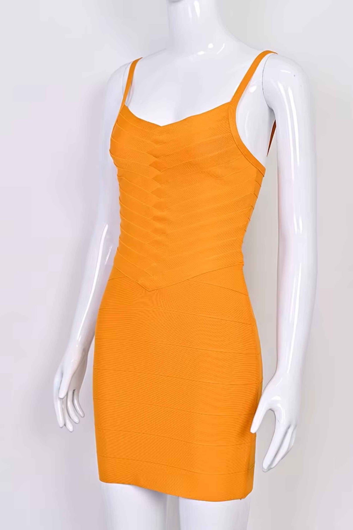 Woman wearing a figure flattering Dom Bandage Mini Dress - Apricot Orange BODYCON COLLECTION Pty Ltd