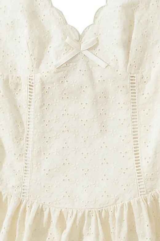 Woman wearing a figure flattering Dovie Bodycon Mini Dress - White Pearl BODYCON COLLECTION Pty Ltd