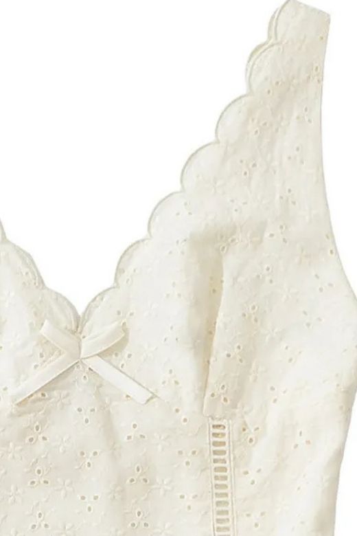 Woman wearing a figure flattering Dovie Bodycon Mini Dress - White Pearl BODYCON COLLECTION Pty Ltd