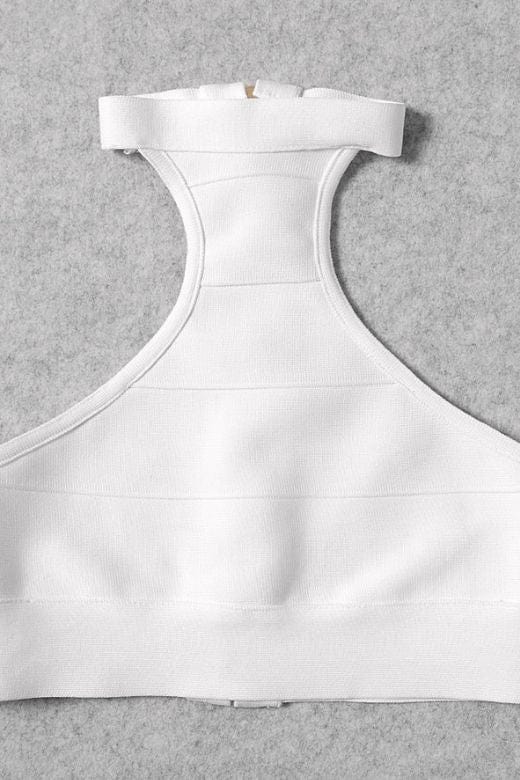 Woman wearing a figure flattering Elli Bandage Crop Top - Pearl White BODYCON COLLECTION