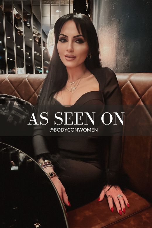 Woman wearing a figure flattering Erin Long Sleeve Bandage Mini Dress - Classic Black BODYCON COLLECTION