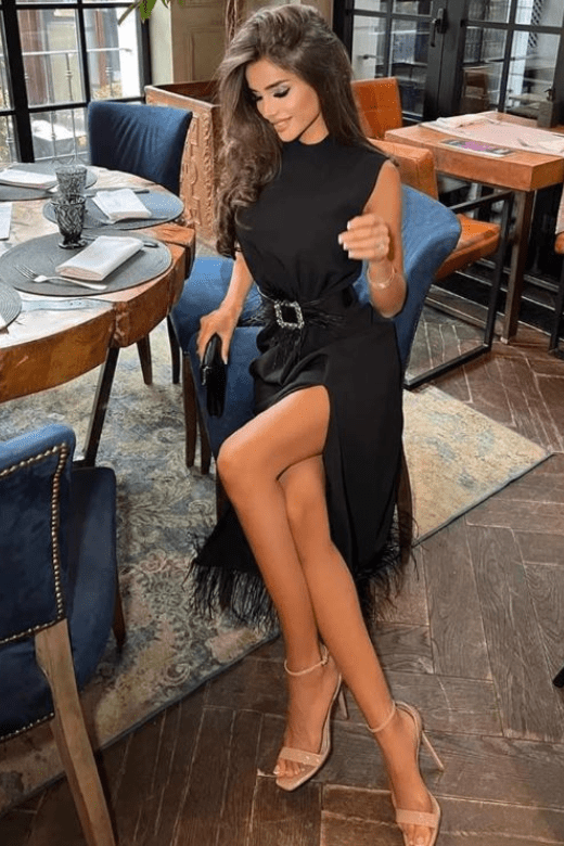 Woman wearing a figure flattering Erin Sleeveless Bodycon Dress - Classic Black BODYCON COLLECTION