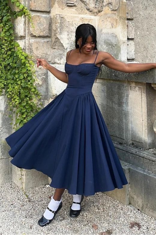 Woman wearing a figure flattering Everly Bodycon Day Midi Dress - Navy Blue BODYCON COLLECTION